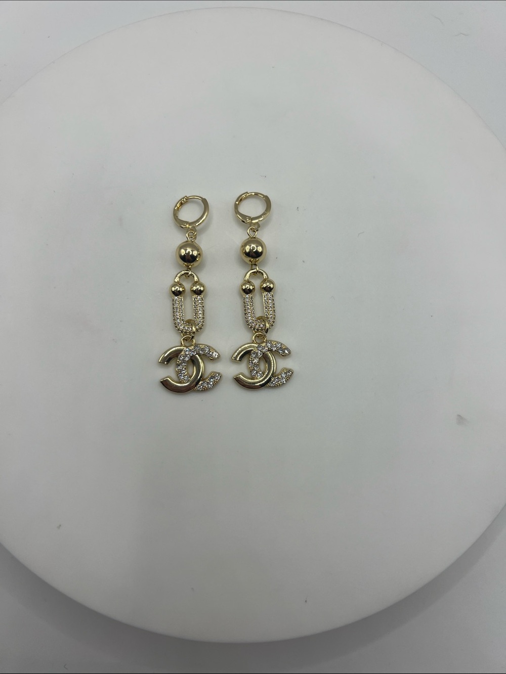 1446. Gold-Tone Dangle Earrings with Interlocking Stamped Logo Charm. - Picture 3 of 5